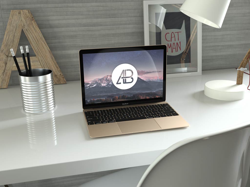 Gold MacBook (12 inch) on a Desk Mockup | Mockup World