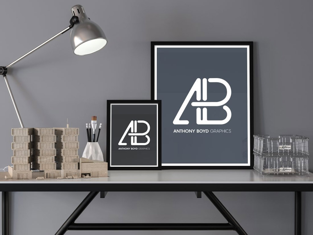 two-posters-on-a-desk-mockup-mockup-world