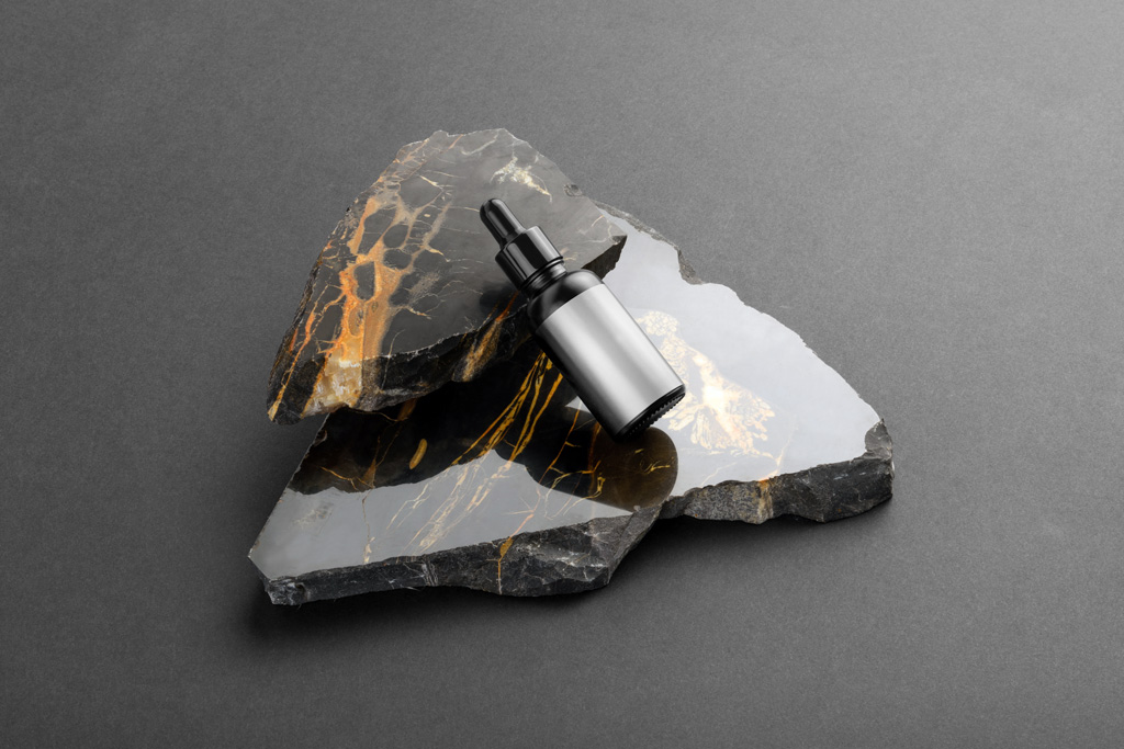 Cosmetic Dropper Bottle on Marble Stone Mockup - Mockup World