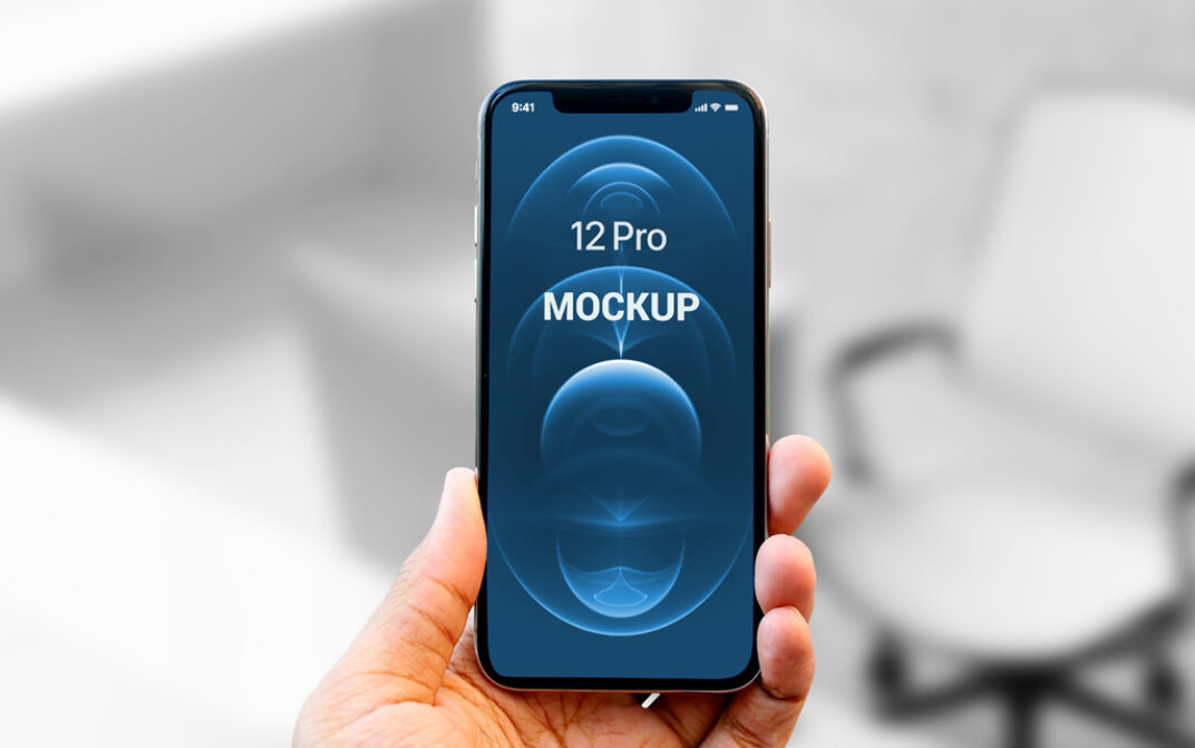 Hand holding iPhone 12 Pro Mockup - Mockup World