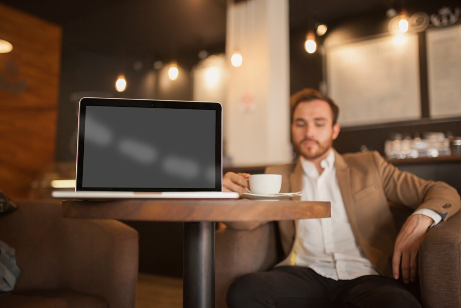 MacBook in a Café Mockup Generator - Mockup World