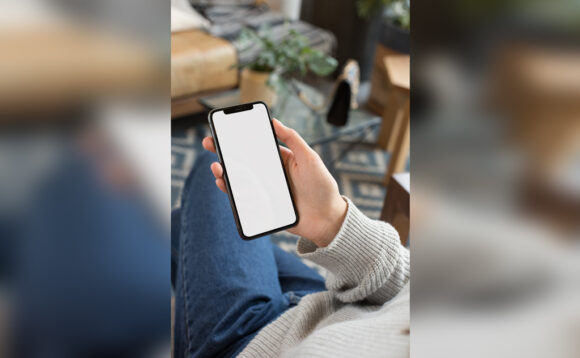 Woman Looking At Iphone Mockup Generator - Mockup World